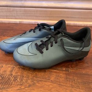A Nike black and gray soccer shoe